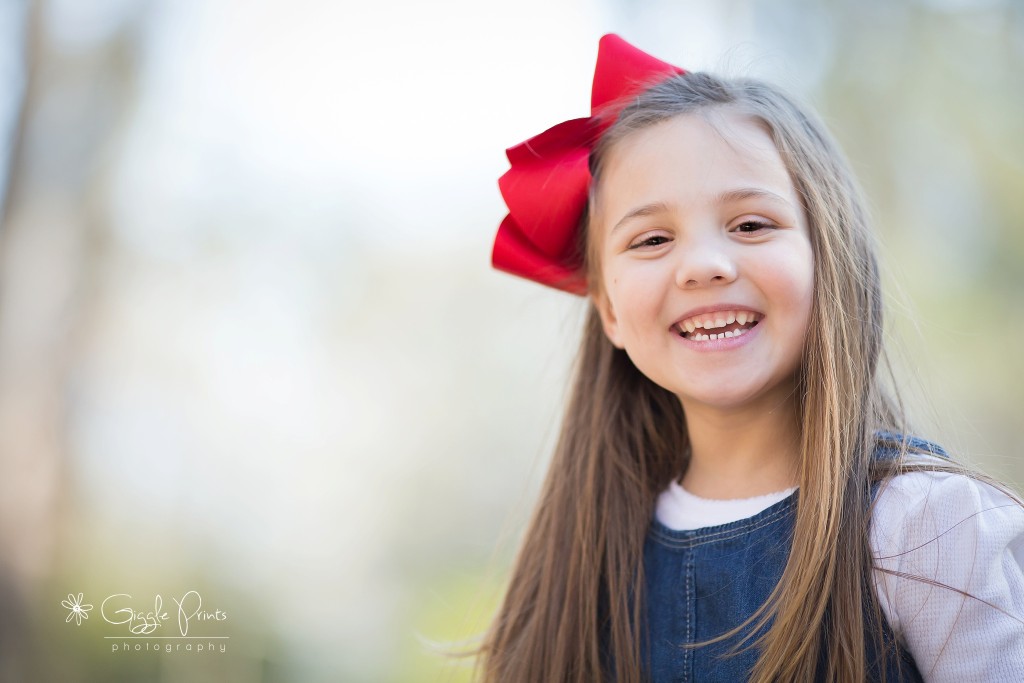 Atlanta Family Photographer - GigglePrints  girl outside happy smiling red bow
