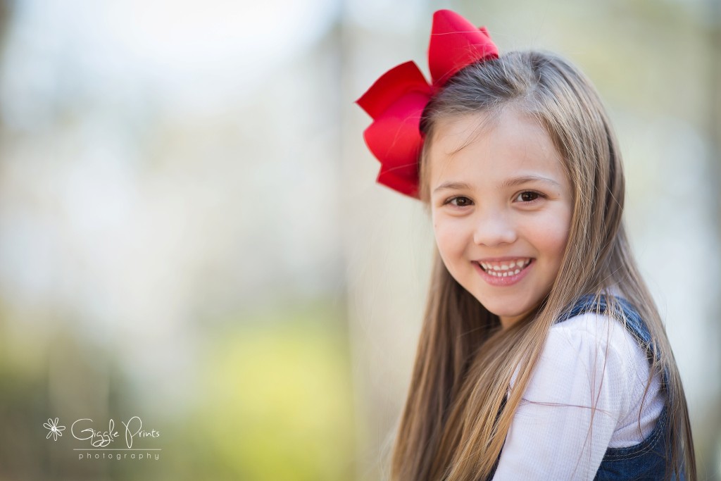 Atlanta Family Photographer - GigglePrints  girl outside happy red bow smiles joy